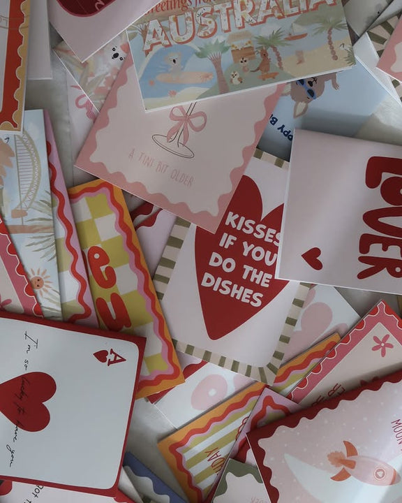 Collection of various greeting cards with different designs and text.