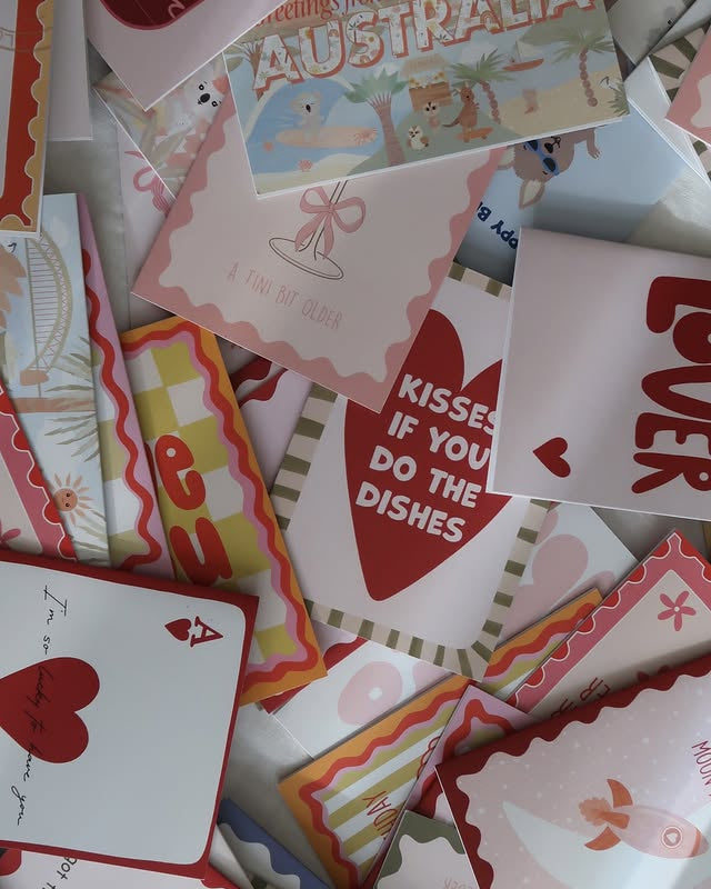 Collection of various greeting cards with different designs and text.